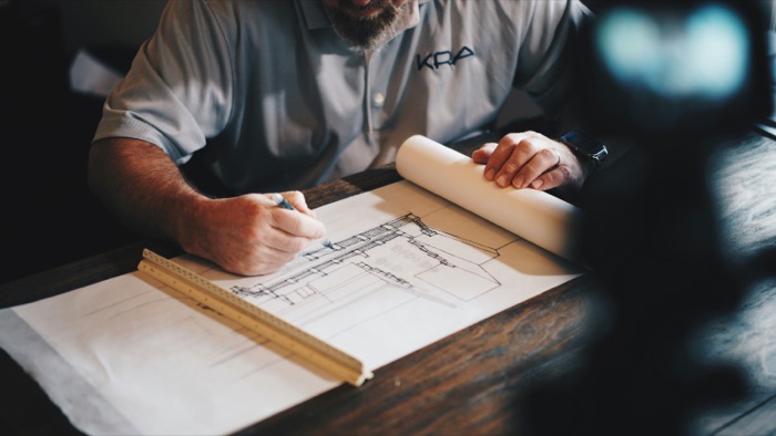 Architect reviewing design plans